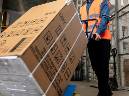 man-with-helmet-carrying-boxes-(1)